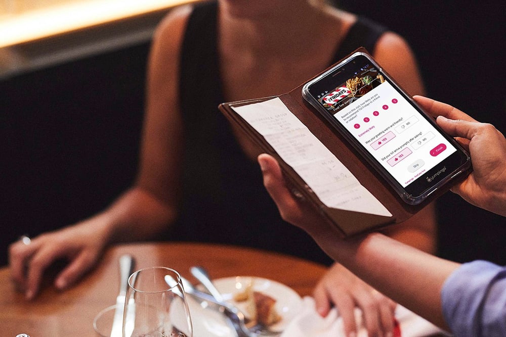 tgi-fridays provides a mobile device with the bill